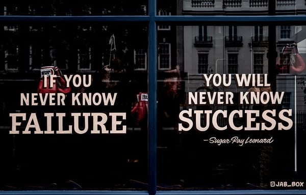 Shop window with writing on two panes. First pane is “If you never know failure”, second pain is “you will never know success